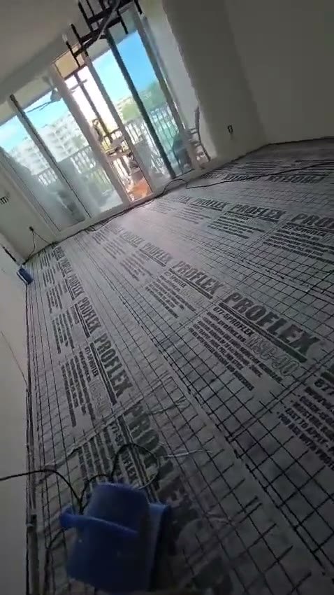 Video of a room with an uncoupling membrane covering the subfloor